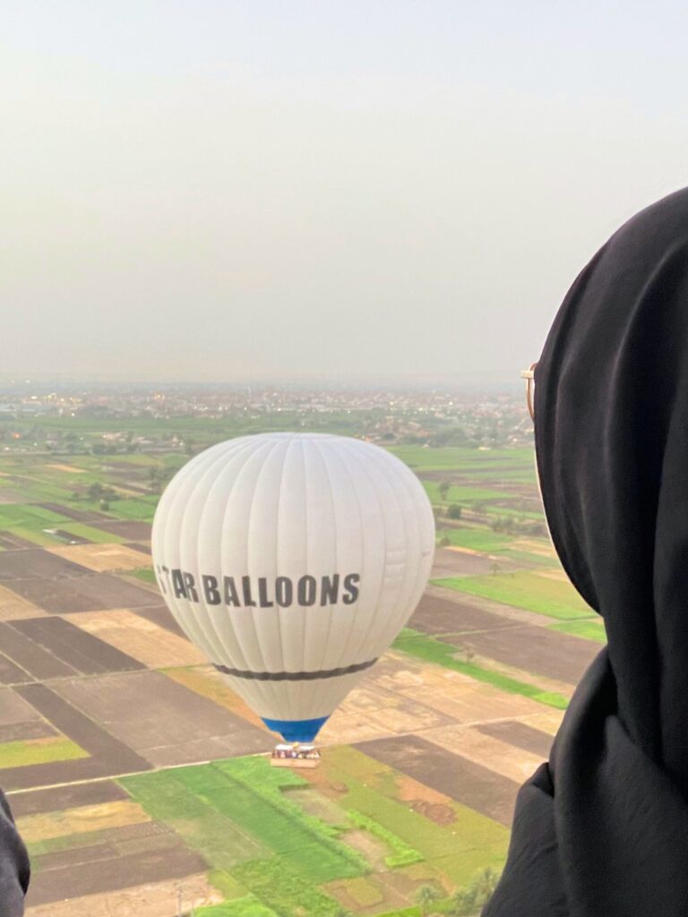 Somebody in a hot air balloon is looking at the view in Egypt, Luxor